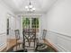 Elegant dining room with tray ceiling, modern chandelier, and large windows offering natural light at 4733 Julian Way, Acworth, GA 30101