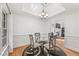 Elegant dining room with tray ceiling, modern chandelier, and large windows offering natural light at 4733 Julian Way, Acworth, GA 30101