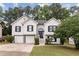 Charming two-story home features a manicured lawn and attached two-car garage, enhancing curb appeal at 4733 Julian Way, Acworth, GA 30101