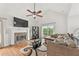 Bright living room with a stone fireplace, soaring ceilings, and hardwood floors, offering a cozy and stylish space at 4733 Julian Way, Acworth, GA 30101