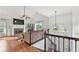 Bright living room with a stone fireplace, soaring ceilings, and hardwood floors, offering a cozy and stylish space at 4733 Julian Way, Acworth, GA 30101
