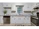 Updated kitchen with white cabinets, granite countertops, stainless steel appliances and subway tile backsplash at 4808 Oak Ct, Ellenwood, GA 30294