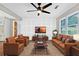 Stylishly furnished living room with hardwood floors, custom wall paneling, and lots of natural light at 4808 Oak Ct, Ellenwood, GA 30294