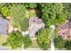 Aerial perspective of a well-maintained home surrounded by lush greenery and mature trees at 5258 Tallgrass Nw Way, Kennesaw, GA 30152