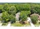 A home with a manicured lawn nestled among mature trees in a peaceful neighborhood at 5258 Tallgrass Nw Way, Kennesaw, GA 30152