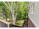 Beautiful backyard with lush greenery, a small pond, and access to a wooden deck with railings at 5258 Tallgrass Nw Way, Kennesaw, GA 30152