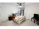 Cozy bedroom with a four-poster bed, decorative pillows, and unique furnishings at 5258 Tallgrass Nw Way, Kennesaw, GA 30152