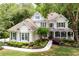 Inviting home with manicured lawn and lush landscaping, with a welcoming front porch and classic design at 5258 Tallgrass Nw Way, Kennesaw, GA 30152