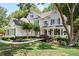 Charming two-story home boasts a beautifully landscaped front yard with mature trees and inviting front porch at 5258 Tallgrass Nw Way, Kennesaw, GA 30152