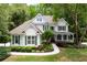 Beautiful home with lush landscaping, a welcoming front porch, and classic architectural details at 5258 Tallgrass Nw Way, Kennesaw, GA 30152