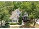 Charming two-story home with manicured lawn, beautiful landscaping, and inviting front porch at 5258 Tallgrass Nw Way, Kennesaw, GA 30152