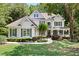 Charming residence with a well-manicured lawn, beautiful landscaping, and an inviting covered front porch at 5258 Tallgrass Nw Way, Kennesaw, GA 30152