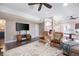 Large living room with hardwood floors, comfortable seating, and a stylish entertainment center at 5258 Tallgrass Nw Way, Kennesaw, GA 30152