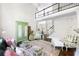 Spacious living room featuring a green cabinet, high ceilings, and coordinated furniture arrangement at 5258 Tallgrass Nw Way, Kennesaw, GA 30152