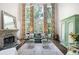 Bright living room boasting tall windows with decorative curtains, a stone fireplace, and stylish furnishings at 5258 Tallgrass Nw Way, Kennesaw, GA 30152