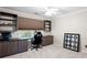 Dedicated office space with built-in desk, shelving and view of the outdoors at 5258 Tallgrass Nw Way, Kennesaw, GA 30152