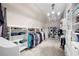 Spacious walk-in closet features custom shelving, hanging racks, and a stylish chandelier at 5258 Tallgrass Nw Way, Kennesaw, GA 30152