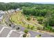 Beautiful community featuring a green space with walking paths and manicured landscaping at 993 Harvest Park Ln, Suwanee, GA 30024