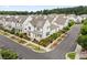 Aerial view of a community of modern homes with well-manicured lawns and streets at 993 Harvest Park Ln, Suwanee, GA 30024
