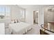 Charming bedroom with a comfortable bed, plush pillows, and a clear doorway to a bathroom at 993 Harvest Park Ln, Suwanee, GA 30024