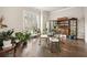 Bright dining room with a view, complemented by stylish furnishings and hardwood flooring at 993 Harvest Park Ln, Suwanee, GA 30024
