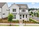 Charming two-story home with a welcoming front porch and beautifully landscaped front yard at 993 Harvest Park Ln, Suwanee, GA 30024