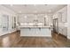 Gourmet kitchen featuring a large island, stainless steel appliances, and ample cabinet space at 993 Harvest Park Ln, Suwanee, GA 30024