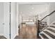 Open-concept design featuring hardwood floors seamlessly connecting the living, dining, and kitchen areas at 993 Harvest Park Ln, Suwanee, GA 30024