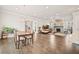 Open-concept living space with hardwood floors, a fireplace, and a well-appointed kitchen, perfect for gatherings at 993 Harvest Park Ln, Suwanee, GA 30024