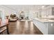 Expansive open-concept layout showcasing hardwood floors, a cozy fireplace, and a modern kitchen at 993 Harvest Park Ln, Suwanee, GA 30024