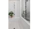 Elegant shower featuring a glass enclosure, seat, and neutral tile at 993 Harvest Park Ln, Suwanee, GA 30024