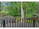 Picture-perfect backyard view from a balcony, showcasing lush greenery, mature trees, and a tranquil setting at 1291 Stillwood Ne Dr, Atlanta, GA 30306