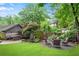 Beautiful backyard featuring a patio with outdoor seating and a lush green lawn, ideal for entertaining at 1291 Stillwood Ne Dr, Atlanta, GA 30306