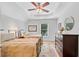 Well-lit bedroom featuring hardwood floors, tray ceiling and two beds at 1291 Stillwood Ne Dr, Atlanta, GA 30306