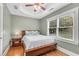 Cozy bedroom with hardwood floors, natural light, and a ceiling fan at 1291 Stillwood Ne Dr, Atlanta, GA 30306