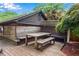 Outdoor dining area on wooden deck with built-in seating and privacy screen, great for entertaining at 1291 Stillwood Ne Dr, Atlanta, GA 30306