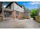 Charming Tudor-style home with brick and stucco exterior, a paved driveway, and well-manicured landscaping at 1291 Stillwood Ne Dr, Atlanta, GA 30306