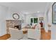Bright living room featuring a brick fireplace, white walls, and natural light at 1291 Stillwood Ne Dr, Atlanta, GA 30306