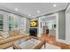 Comfortable living room with a sofa, shuttered windows, and open doorway at 1291 Stillwood Ne Dr, Atlanta, GA 30306