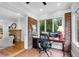 Comfortable office space with a desk, office chair, and brick accent wall at 1291 Stillwood Ne Dr, Atlanta, GA 30306