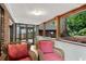 Relaxing screened porch with comfortable seating and a view of the beautiful backyard at 1291 Stillwood Ne Dr, Atlanta, GA 30306