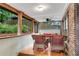 Inviting screened porch with comfortable wicker seating and a view of the lush backyard at 1291 Stillwood Ne Dr, Atlanta, GA 30306