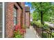Inviting porch area with a red bench and iron railing, perfect for relaxation at 1291 Stillwood Ne Dr, Atlanta, GA 30306