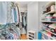Organized walk-in closet offering ample storage space with shelving and hanging racks at 1291 Stillwood Ne Dr, Atlanta, GA 30306