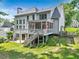 Expansive backyard featuring a deck with porch and seating at 2073 Woodside Park Dr, Woodstock, GA 30188