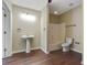 Bathroom featuring a pedestal sink, a decorative light fixture and shower at 2073 Woodside Park Dr, Woodstock, GA 30188
