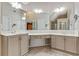 Bright bathroom with double vanity, large mirror, and neutral color palette at 2073 Woodside Park Dr, Woodstock, GA 30188
