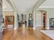 Spacious foyer featuring hardwood floors and decorative molding, offering a grand entrance to the home at 2073 Woodside Park Dr, Woodstock, GA 30188