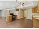 Open kitchen featuring wood floors, an oven, white appliances and plentiful cabinet storage and adjacent dining area at 2073 Woodside Park Dr, Woodstock, GA 30188