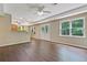 Spacious living room featuring wood floors, natural light, and neutral color palette at 2073 Woodside Park Dr, Woodstock, GA 30188